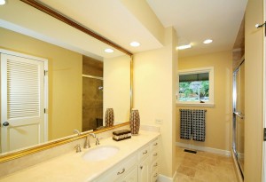 remodeled master bath with newly tiled shower and travertine flooring