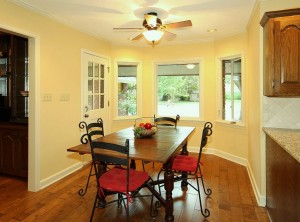 breakfast nook, bay window and exit to covered patio in midtown tulsa home for sale