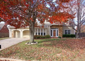 Front of home showing mature trees, covered porch - must see walkway to door!