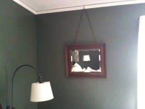 Crown molding used to hold a hook to hand pictures