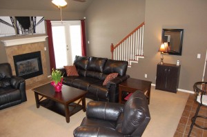 Great Room with fireplace and vaulted ceiling at 9022 N 157th E Ave in Owasso OK