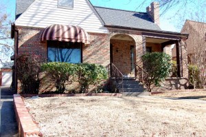 Full brick bungalow with arched entry & huge covered porch