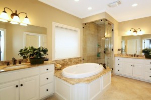 master bath includes built-in cabinetry, whirlpool bath, and separate shower.