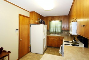 Garage access to left of refrigerator in this midtown Tulsa home for sale