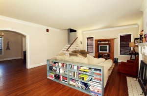 living room and arched entry to dining room