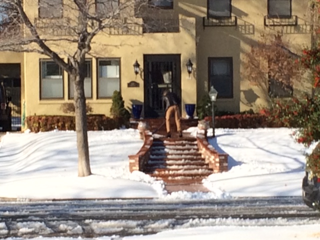 shoveling snow on steps for safe entry
