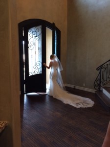 bride looking out doors